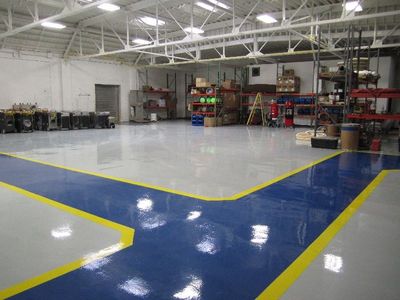 an area of an industry that has an epoxy flooring with a design of line colors