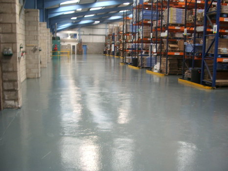 an area of an industrial wich have many files of a product and has also a shinning epoxy type of flooring.